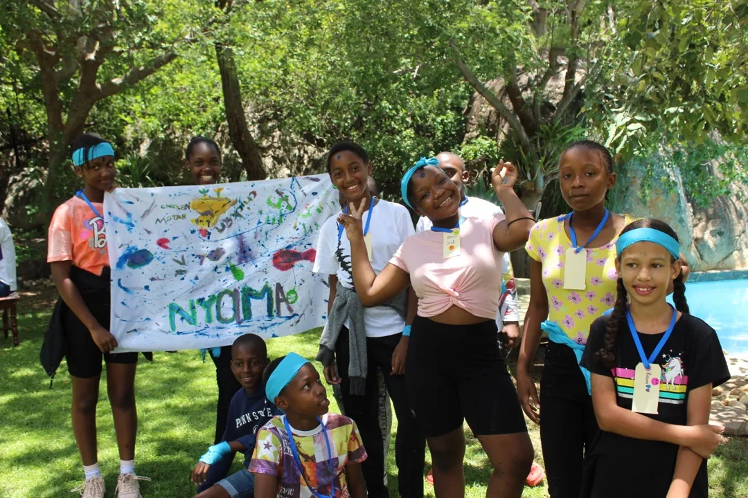 Youth crafting team banner at Leadership and Discipleship camp
